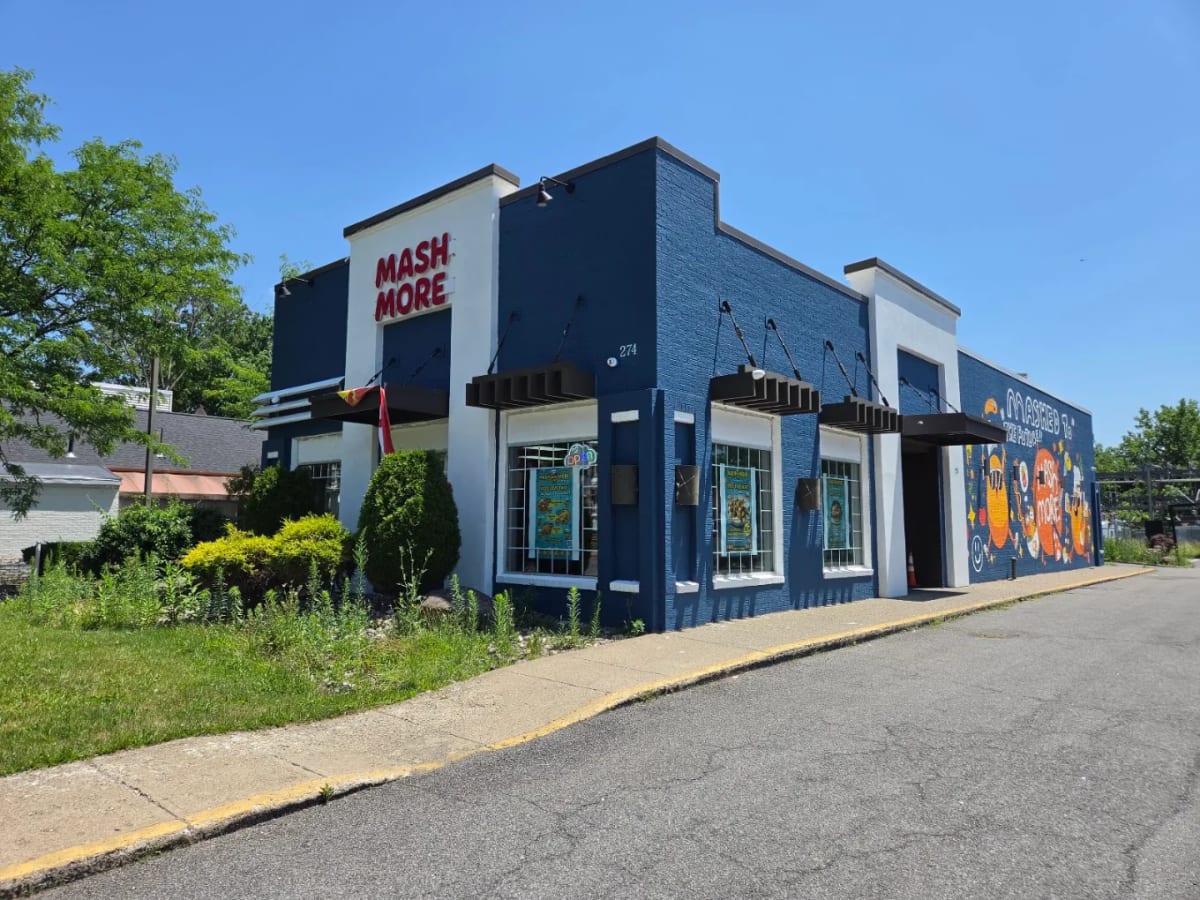 The MashMore storefront on Delaware Ave — a blue building with a red MASH MORE sign