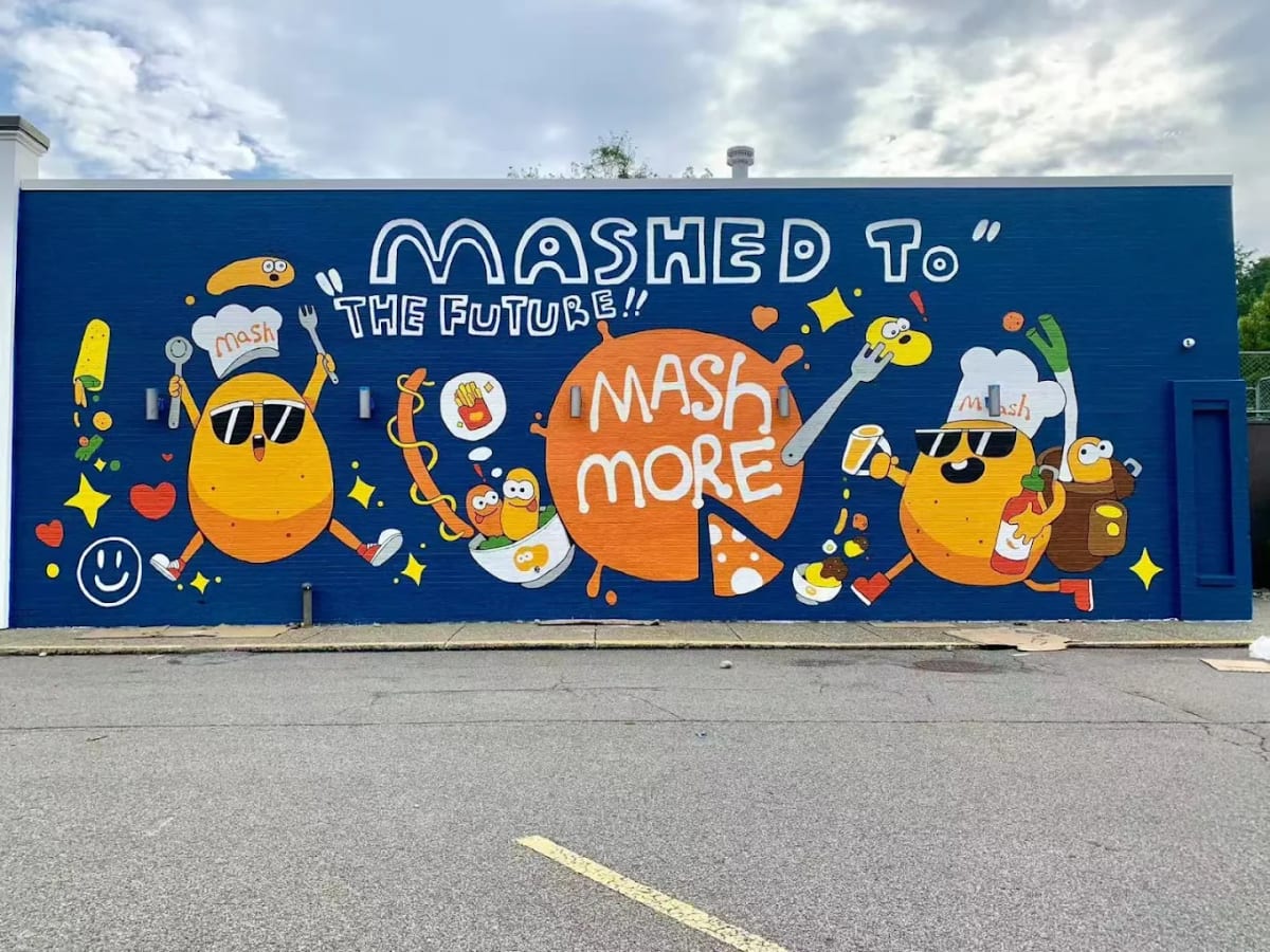 The Mashed to the Future mural along the side of the MashMore building